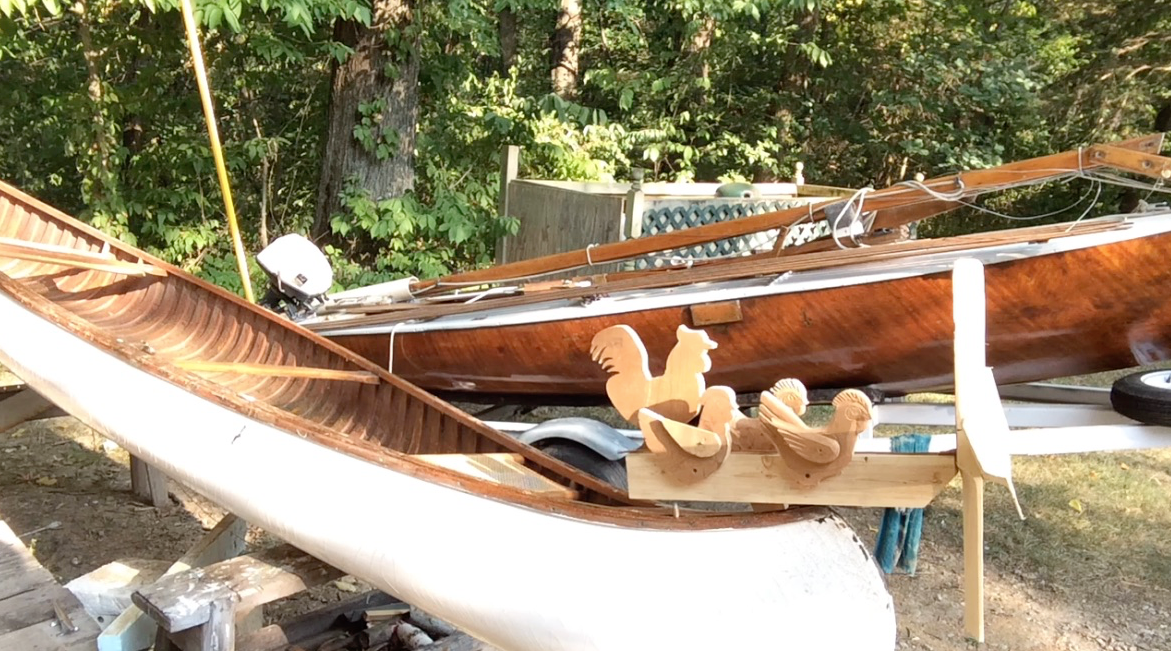 canoe with whirly gig.png