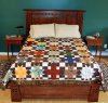 Quilt shown on a queen size bed.JPG