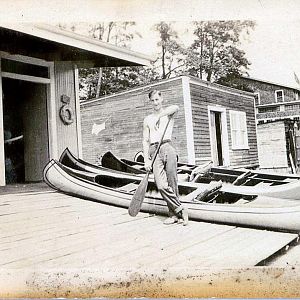 Man Standing On Dock Al Breeds Canoe House