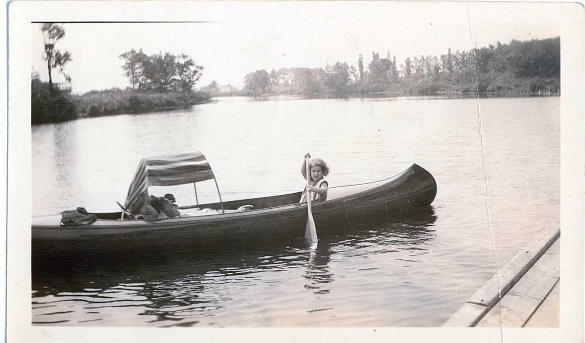 Al And Jane Breed Canoeing On River