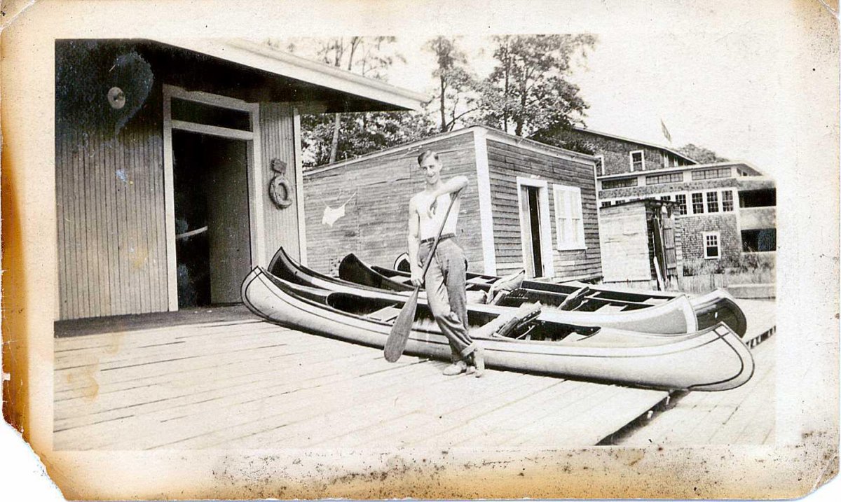 Man Standing On Dock Al Breeds Canoe House